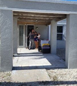 a veteran and her family in their new home